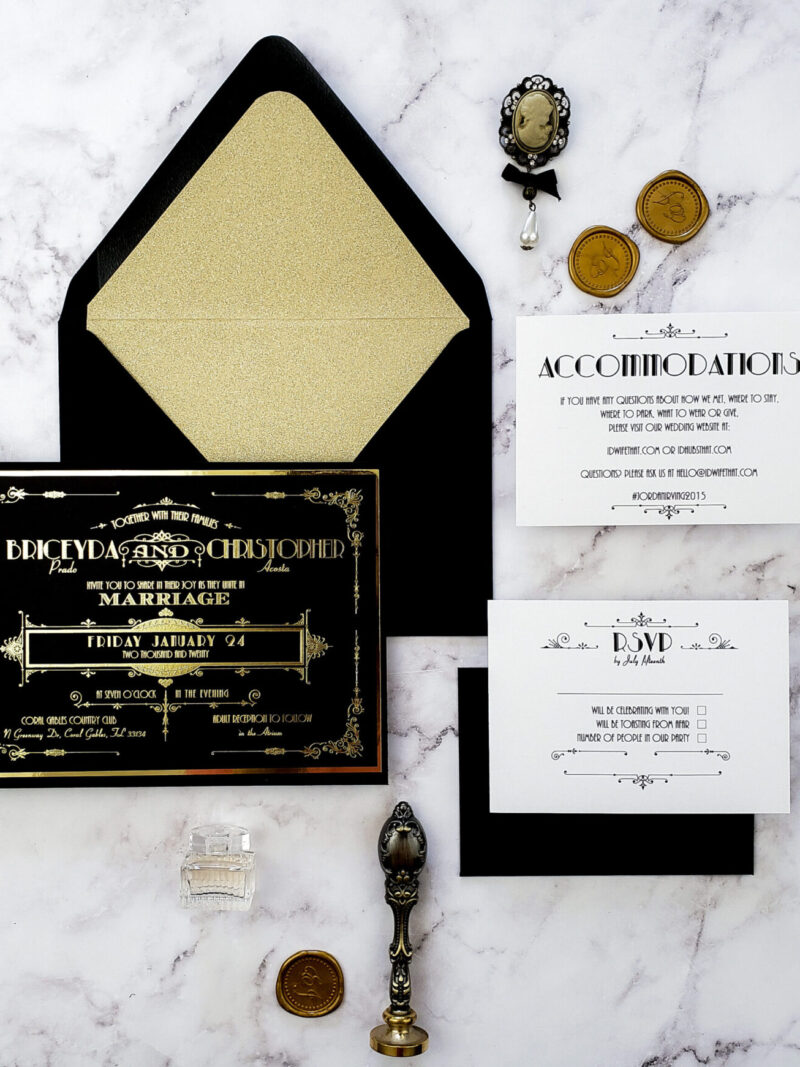 art deco style black and gold wedding invitations with gold wax seal