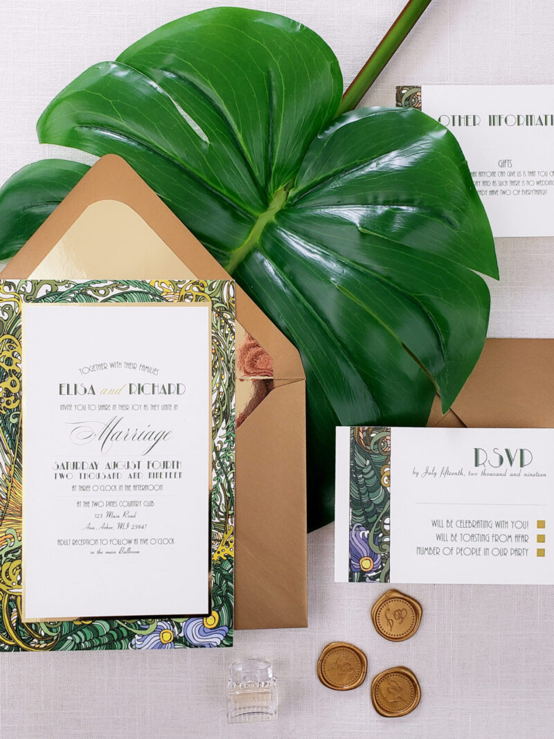 wedding invite in brown envelope with tropical border