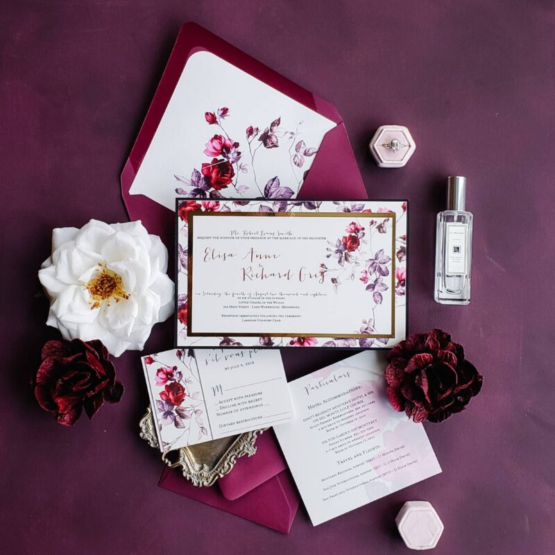 Wedding invitations, envelops, and a cologne