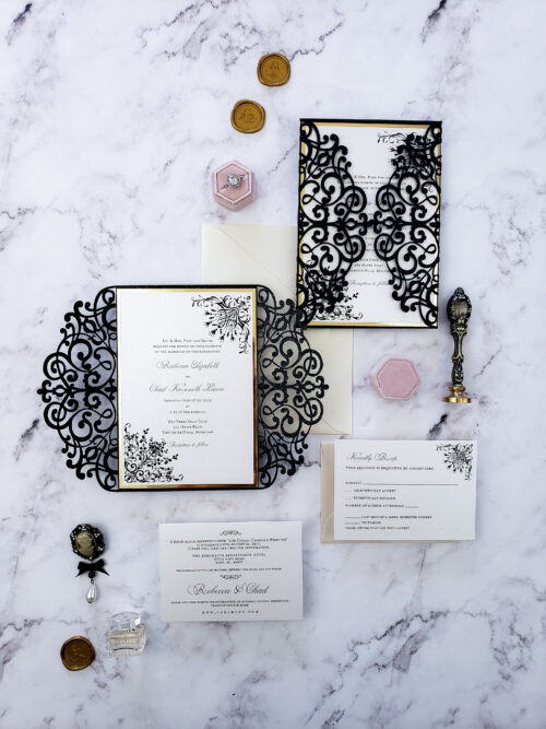 black laser cut wedding invitations with gold border and white stationery