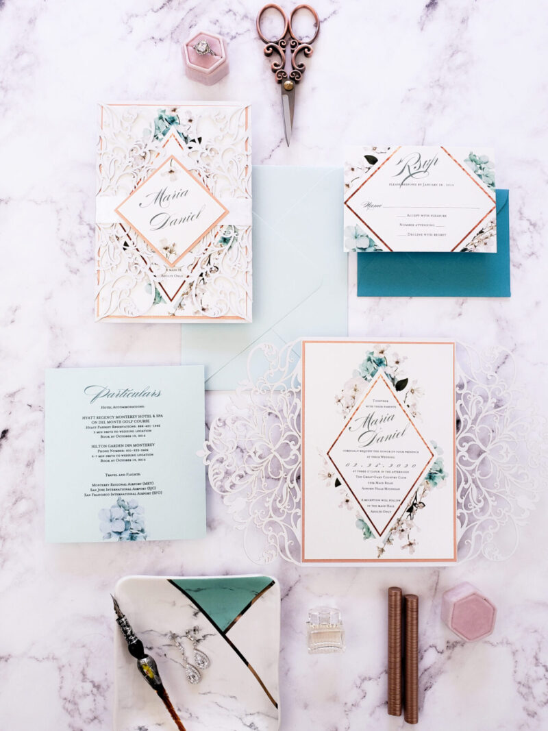 teal envelope with white lace laser cut wedding invitations