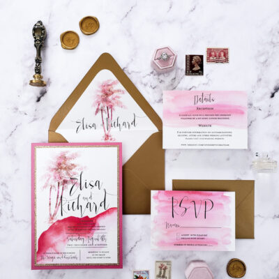 watercolor pink-themed stationery with brown envelope and gold wax seal
