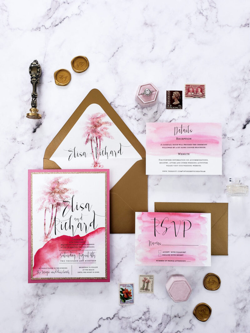watercolor pink-themed stationery with brown envelope and gold wax seal
