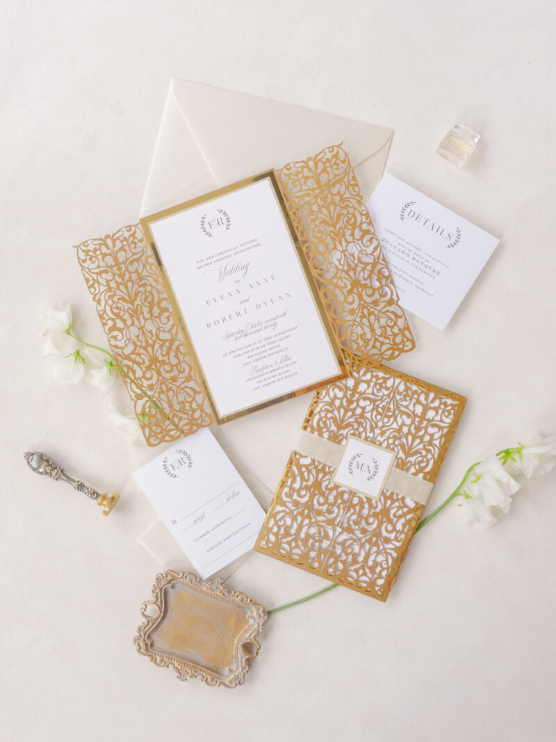 Elegant gold laser cut wedding invitation with intricate floral design and customizable details for luxury weddings