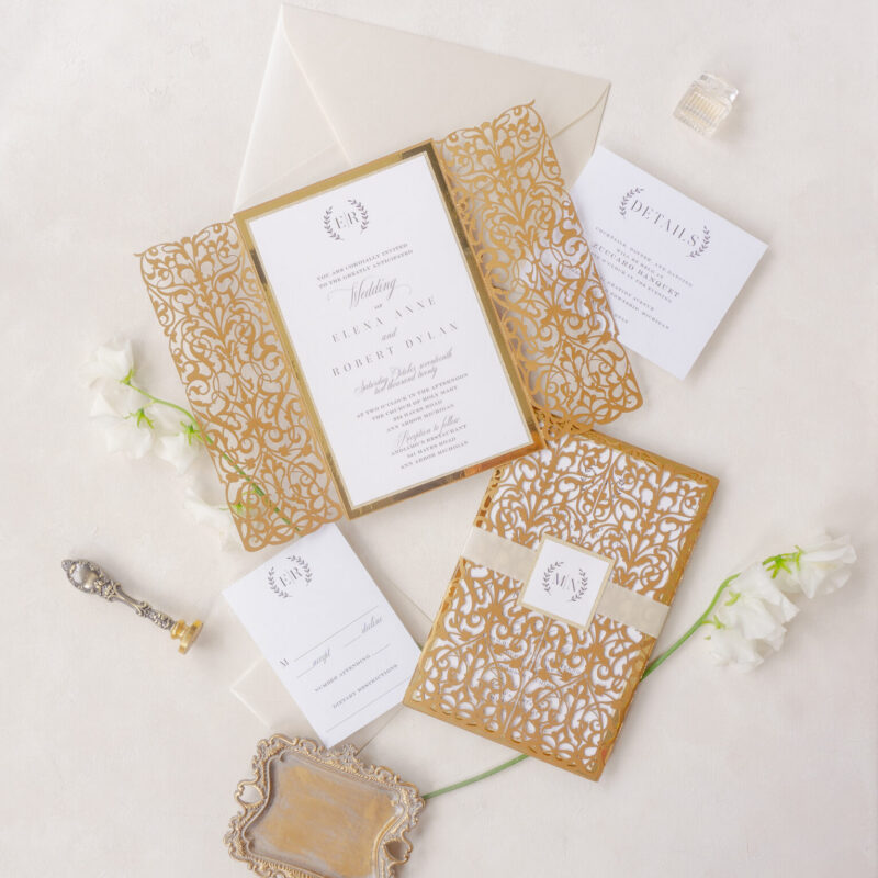 Elegant gold laser cut wedding invitation with intricate floral design and customizable details for luxury weddings