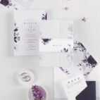 purple and white stationery with flowers on bellyband