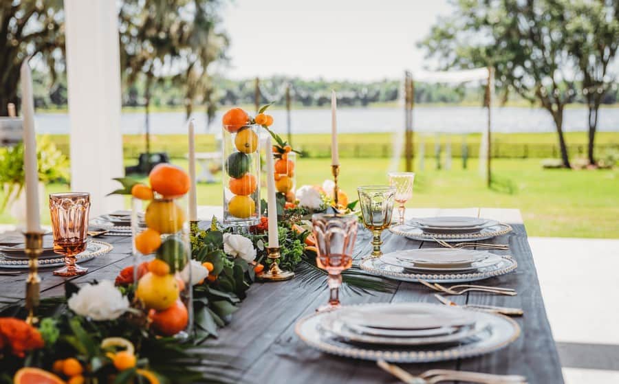 wedding-reception-table-layout-wooden-citrus-runner Beautiful table décor with fruit centerpieces