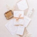 simple elegant wedding invitation suite with ribbon