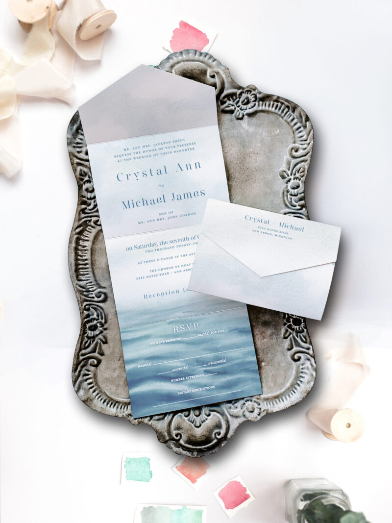 nice wedding invitation on tray water inspired