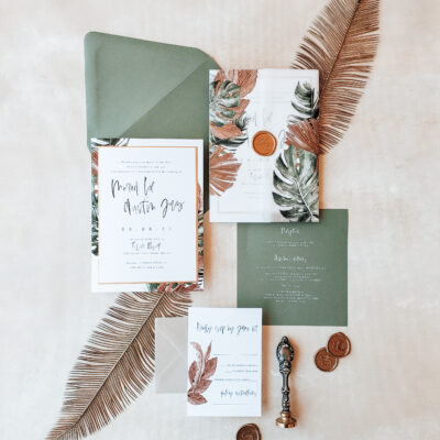 green envelopes with orange and green leaf design