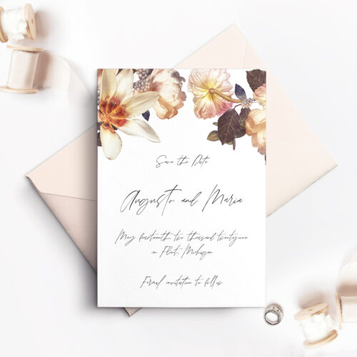 white save the date card with envelope and flowers