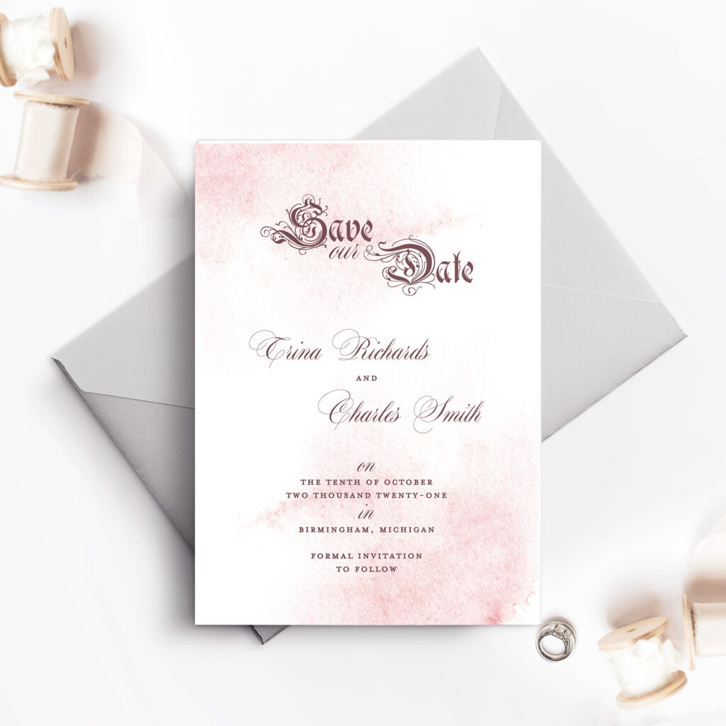 save the date card with pale blue envelope and light paint spray design