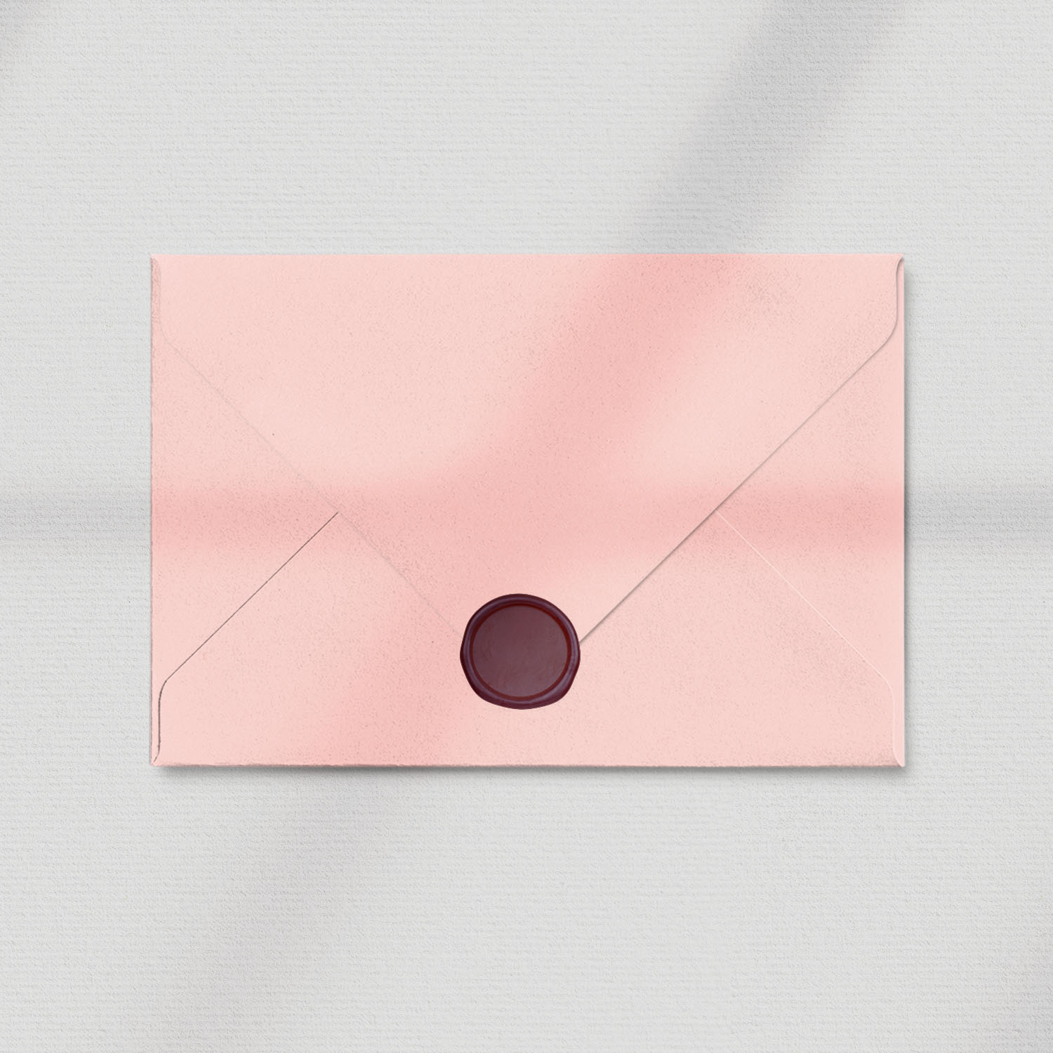 pink envelope with maroon wax seal