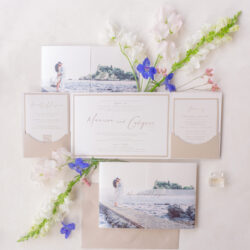 Neutral custom wedding folio invitation with customizable photo front for a destination wedding.