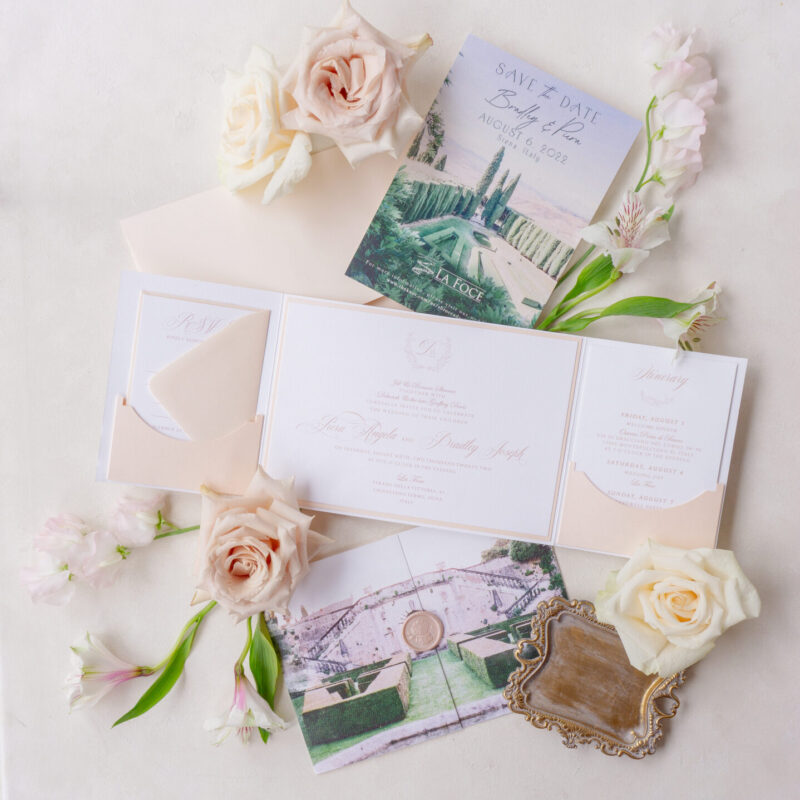 Romantic wedding folio with blush tones and custom venue illustration.