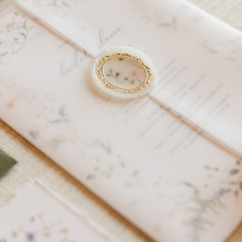 Luxury vellum wedding invitations featuring gate fold, floral wrap, and vellum overlay designs for a romantic and elegant wedding.