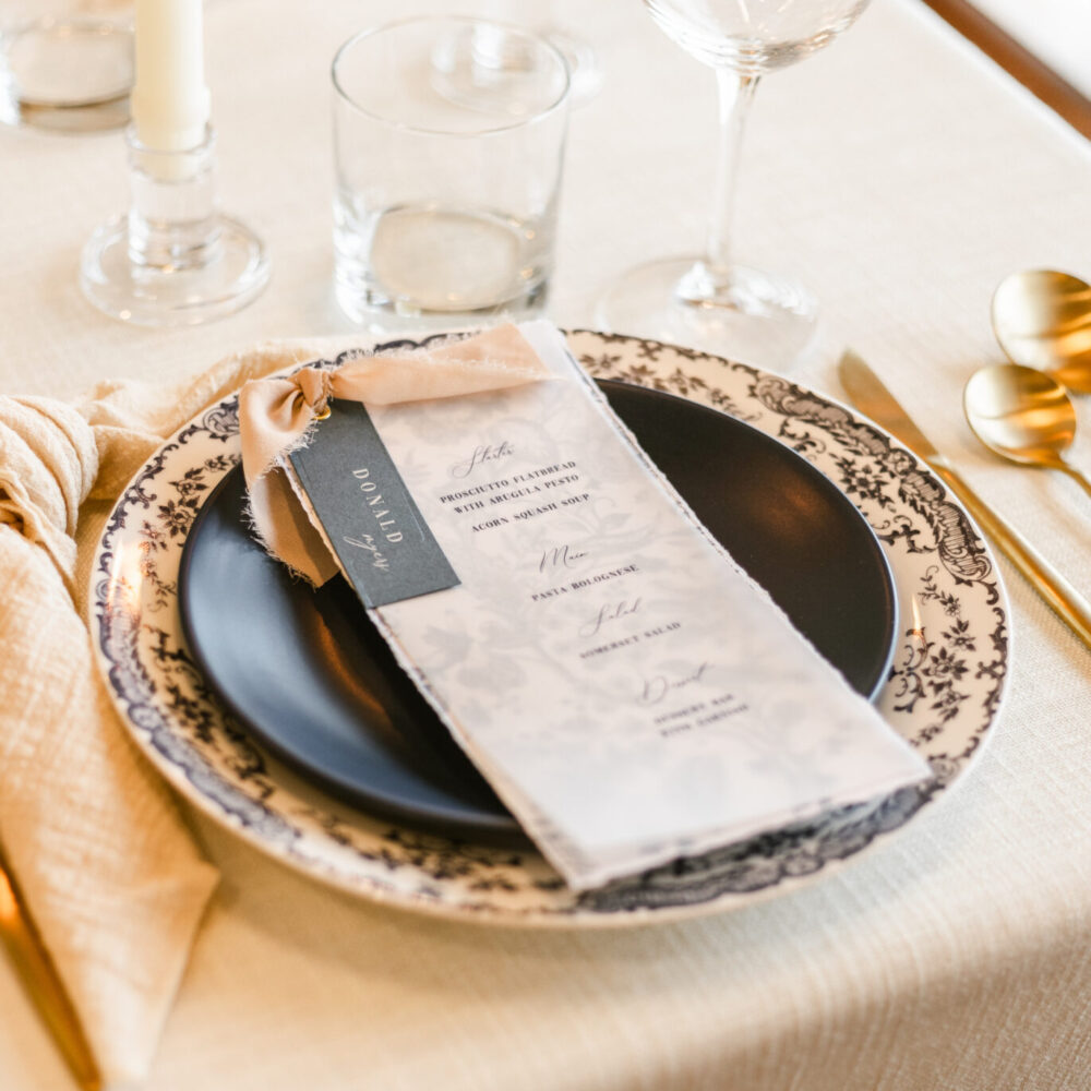 Vellum wedding menu with guest name tag and ribbon accent