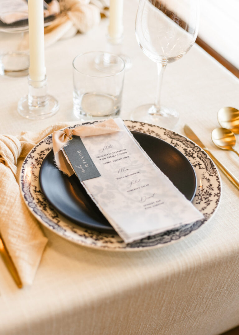 Vellum wedding menu with guest name tag and ribbon accent