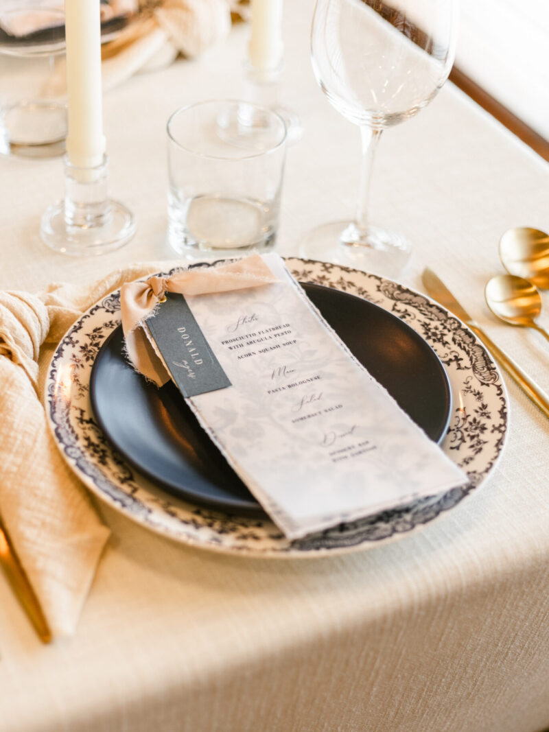 Vellum wedding menu with guest name tag and ribbon accent