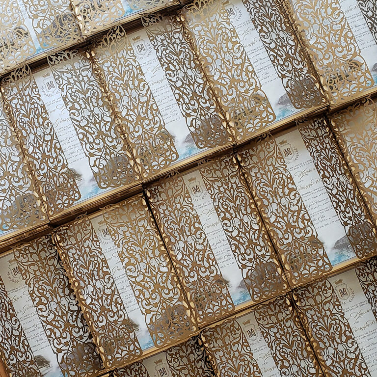 Stack of elegant wedding invitations with RSVP cards and envelopes, helping couples decide how many invitations to order for their wedding