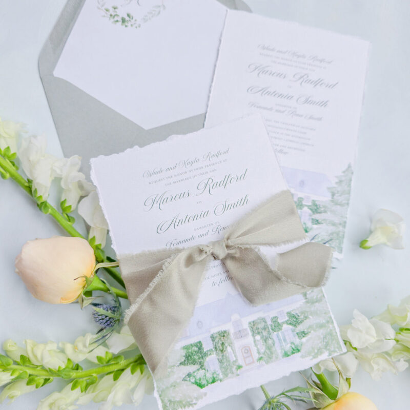 Beautiful watercolor illustration of a wedding venue incorporated into wedding stationery.