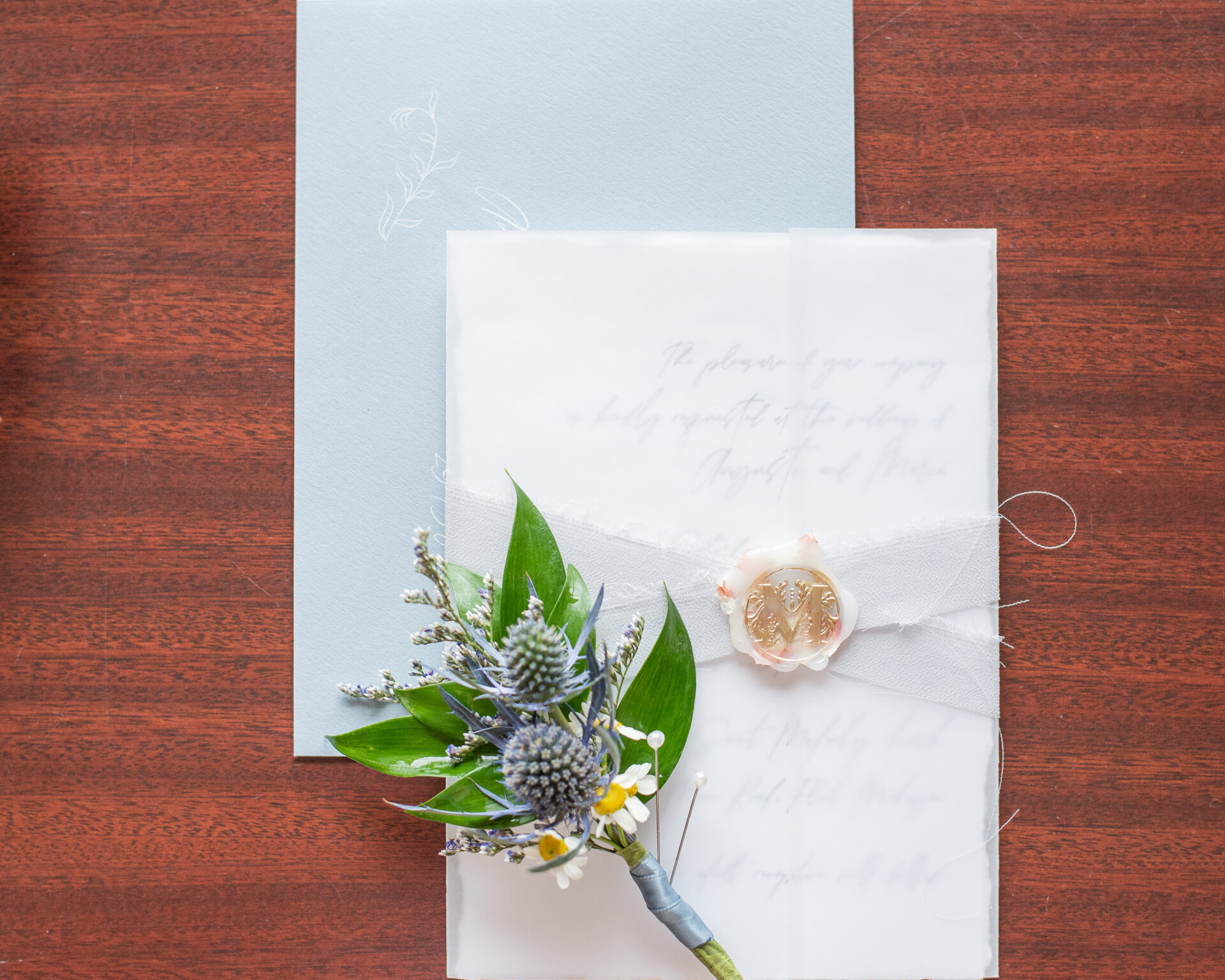 Wedding invitations with custom wax seals, adding a vintage and elegant detail.