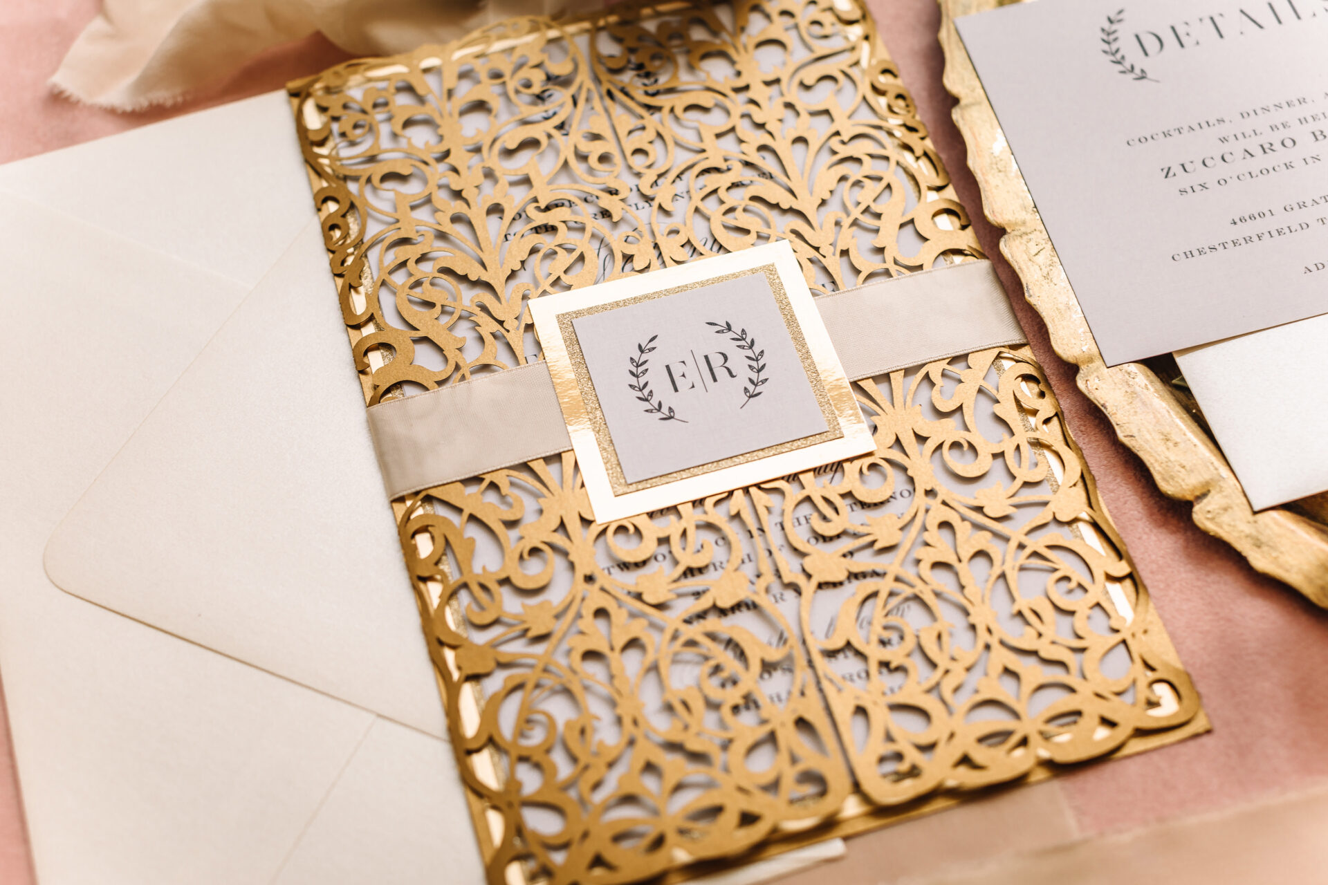 Luxurious gold wedding decor and elegant gold wedding invitations for a royal-inspired celebration.