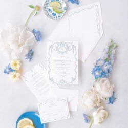 Regency-inspired wedding invitation suite in blue and white with intricate scrollwork, matching RSVP card, details card, and envelope liner.