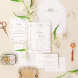 Elegant wedding invitation suite with floral frame design, refined typography, and matching envelope liner