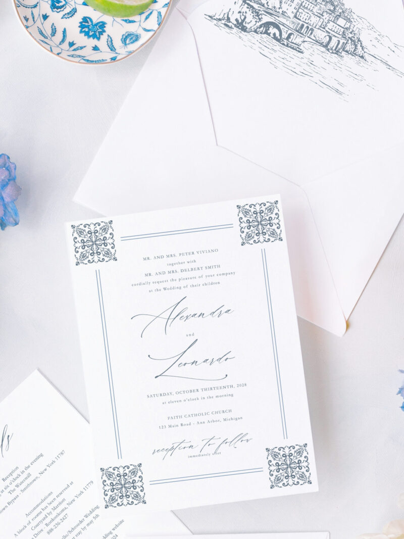 Elegant Amalfi Coast wedding invitation suite with Mediterranean tile patterns and Positano-inspired details.