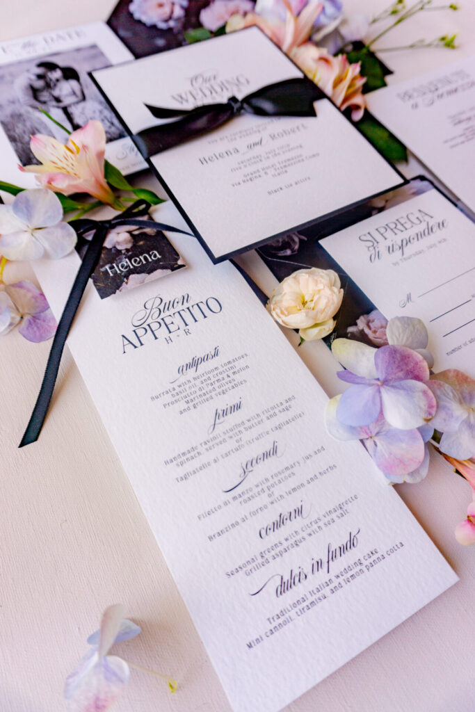 Chic black and white wedding dinner menu with classic typography and floral styling, designed for luxury Lake Como wedding