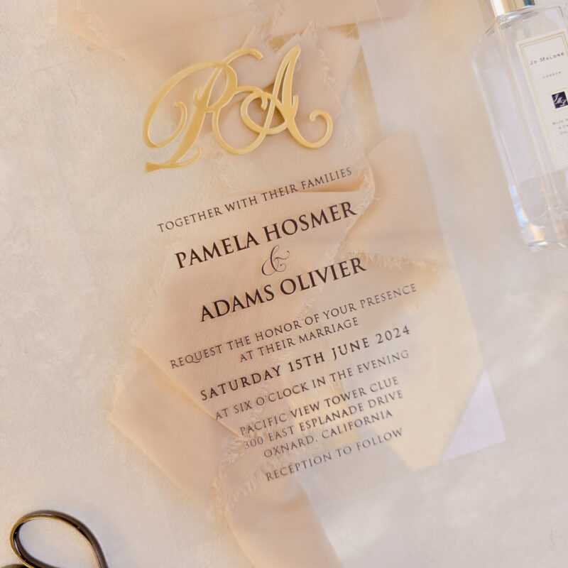 Clear acrylic invitation with custom gold mirror acrylic monogram