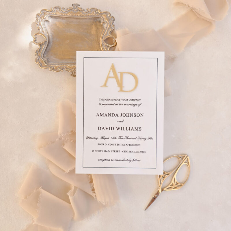 White mirror acrylic invitation suite with raised gold mirror monogram