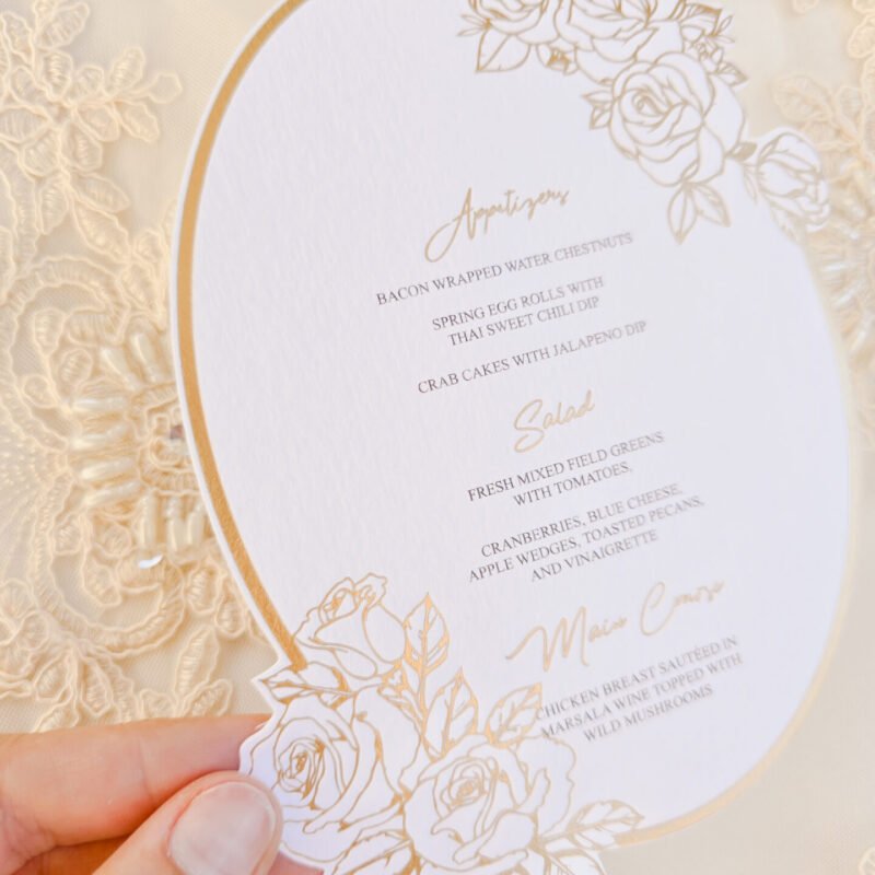 Elegant die cut foiled menu with floral detail
