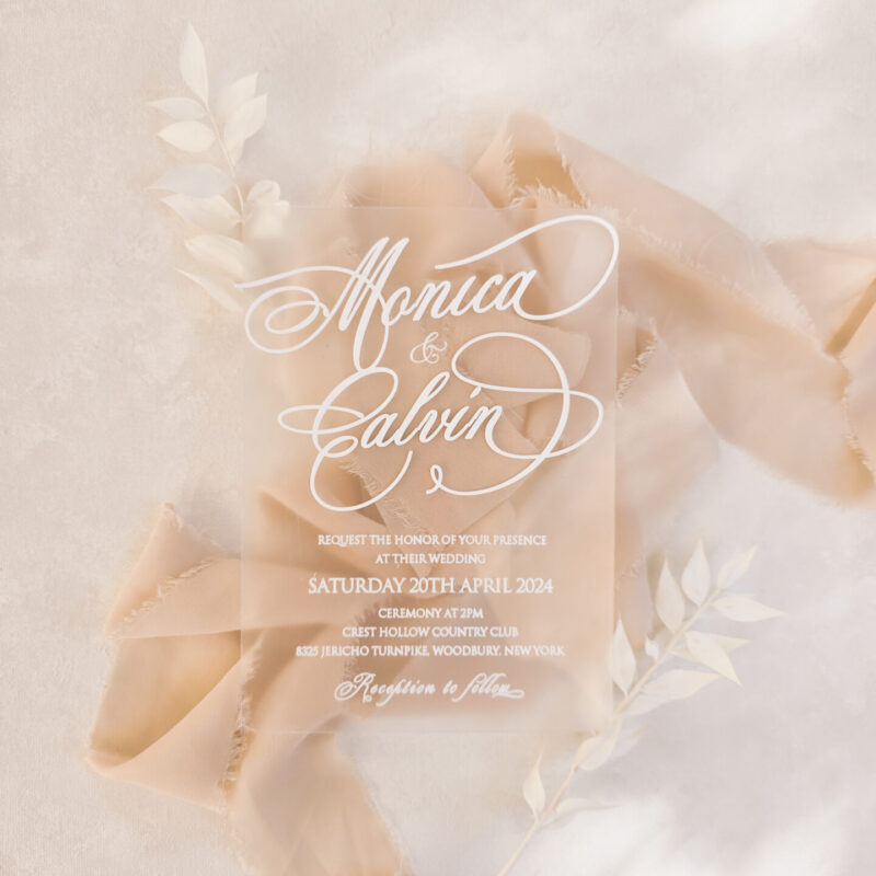 Elegant clear acrylic wedding invite with white ink printing