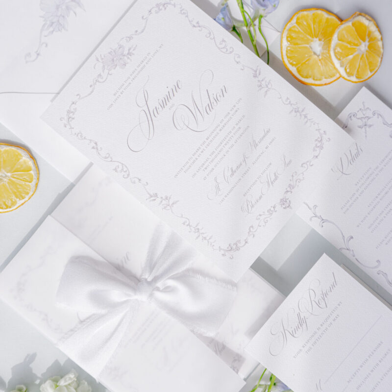 classic wedding invitation with vellum wrap and ribbon